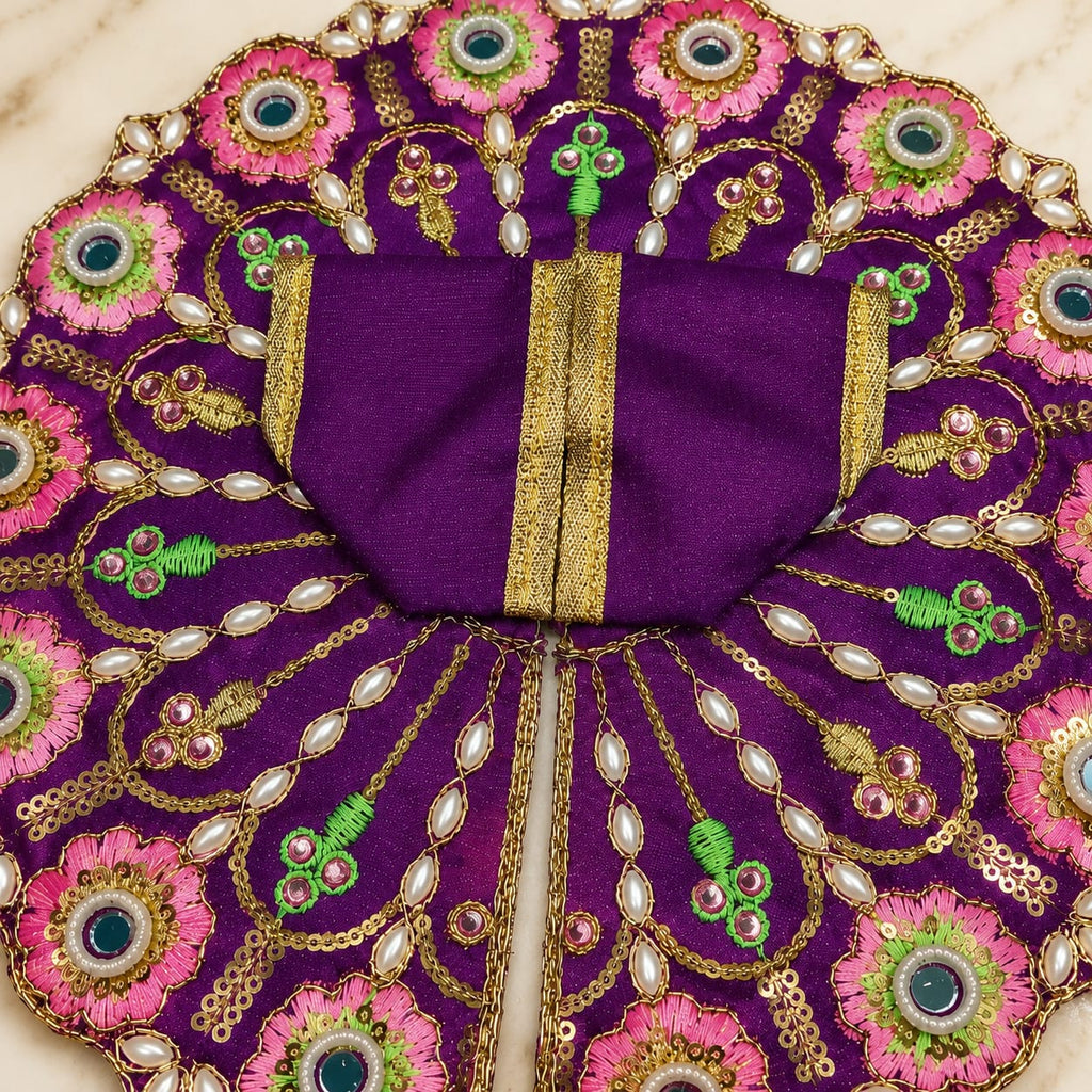 Purple Krishna Ji Poshak dress with pink flowers and pearl embellishments